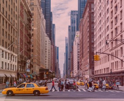 The intersection between homelessness and human trafficking in New York City Woman wearing a blush colored shirt with hair in a ponytail smiling as a child is on her back